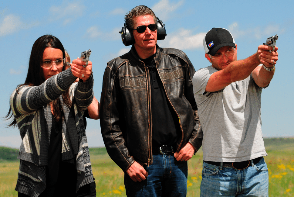 Ann, Rich Wyatt and Jesse trying out their new revolvers.
